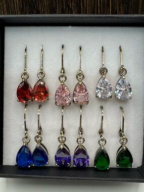 The skyline collection 6 pair set teardrop  CZ antique-gold toned earrings.